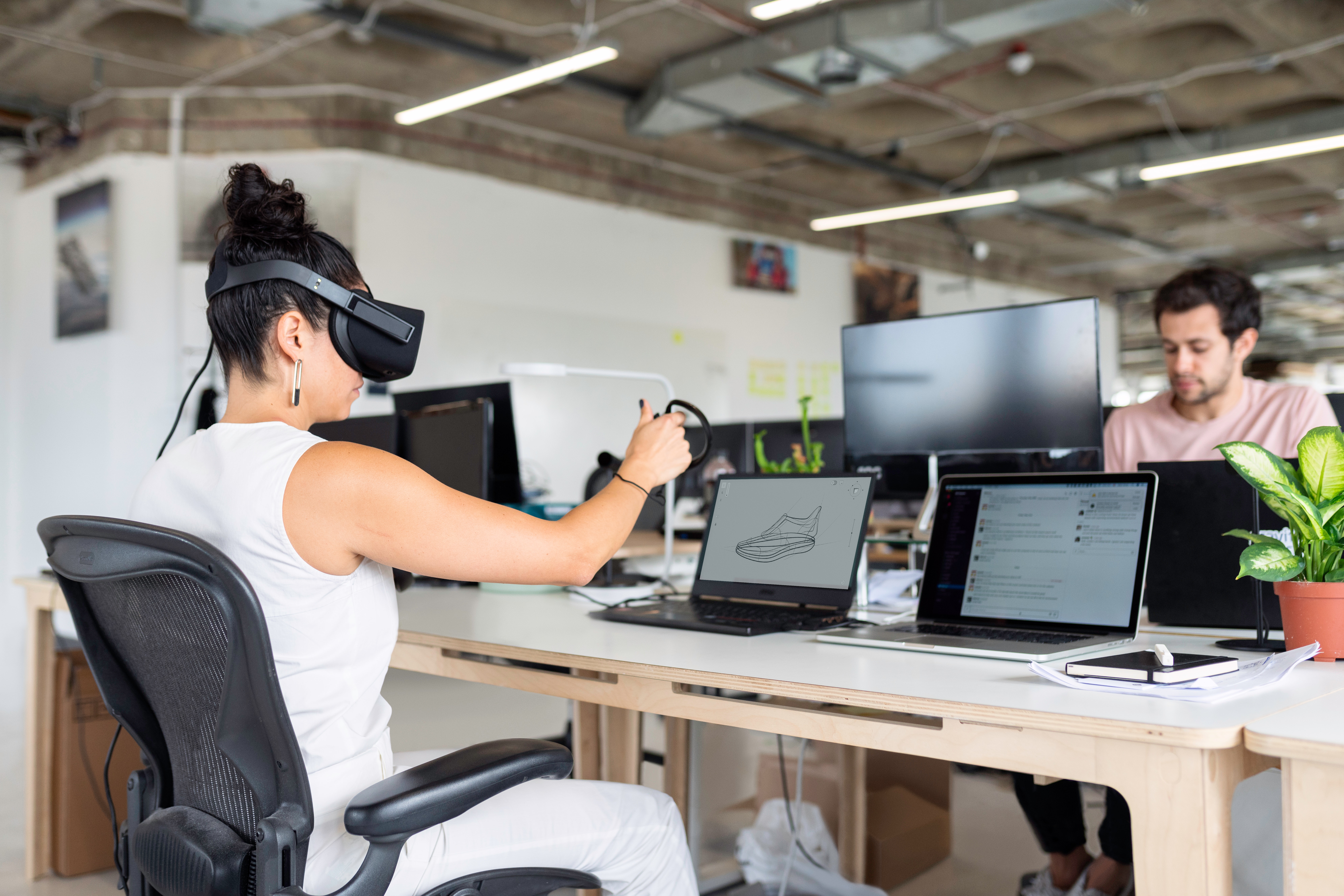 Woman using VR googles at work